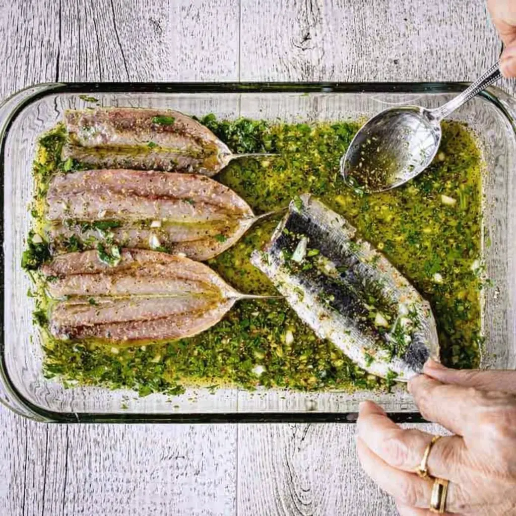 Coating sardines in breadcrumbs