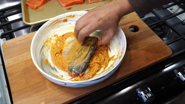 A light drizzle of oil added to tandoori fish halfway through air frying for roasted sheen