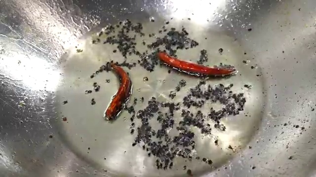Golden fried potato cubes and ground cumin, turmeric, and chili spices added to ridge gourd