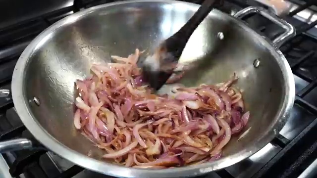 Fresh ginger paste and minced garlic paste added to the caramelized onions in the pan