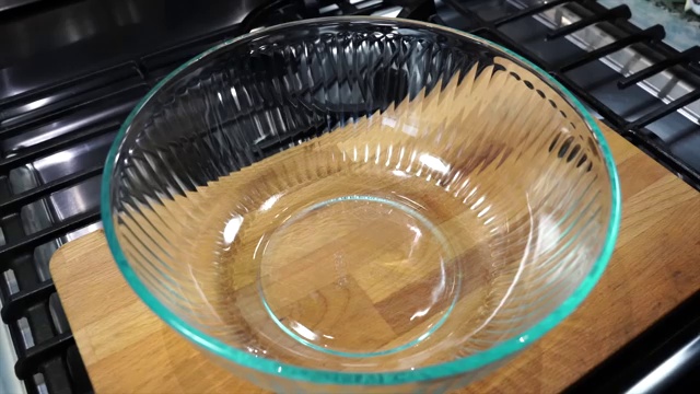 Cooking oil poured into a mixing bowl to form the base of the second spice marinade
