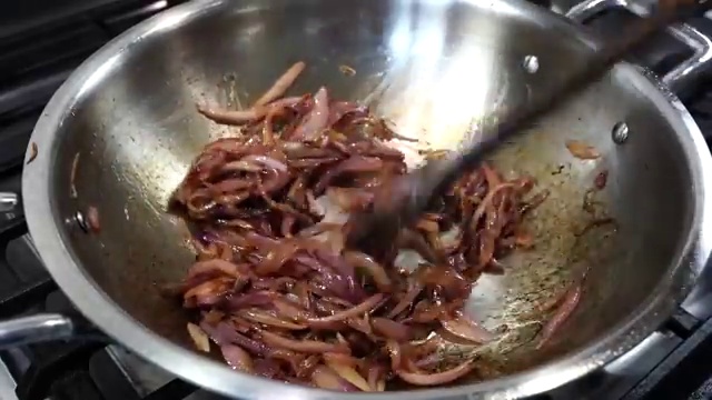 Cleaned bone-in chicken pieces added into the caramelized onion, ginger, and garlic mixture
