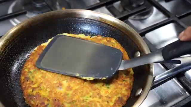 Fragrant sizzled mustard and cumin seed tadka poured into the chickpea chilla batter