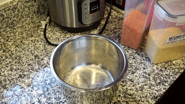 Turmeric, chili powder, ground coriander, and sea salt added to lentils in pressure cooker