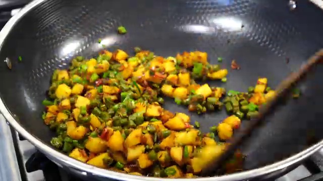 Aloo beans dry sabji served as a complete Indian home meal with warm roti, steamed rice, and dal