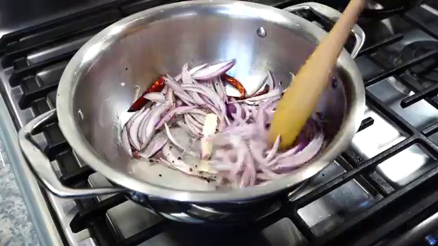 Bengali masoor dal brought to a gentle rolling boil after adding the tempering
