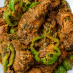Black Pepper Chicken Recipe - Tender chicken simmered in rich caramelized onion and yogurt gravy finished with freshly crushed black pepper and crisp green peppers