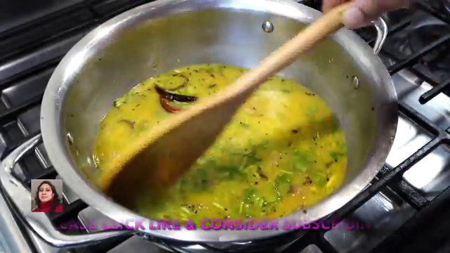 Finished Bengali masoor dal garnished with caramelized browned onions and fresh coriander