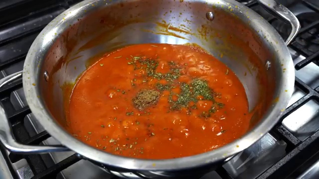 Butter chicken covered with a lid to simmer gently on low heat and absorb flavors