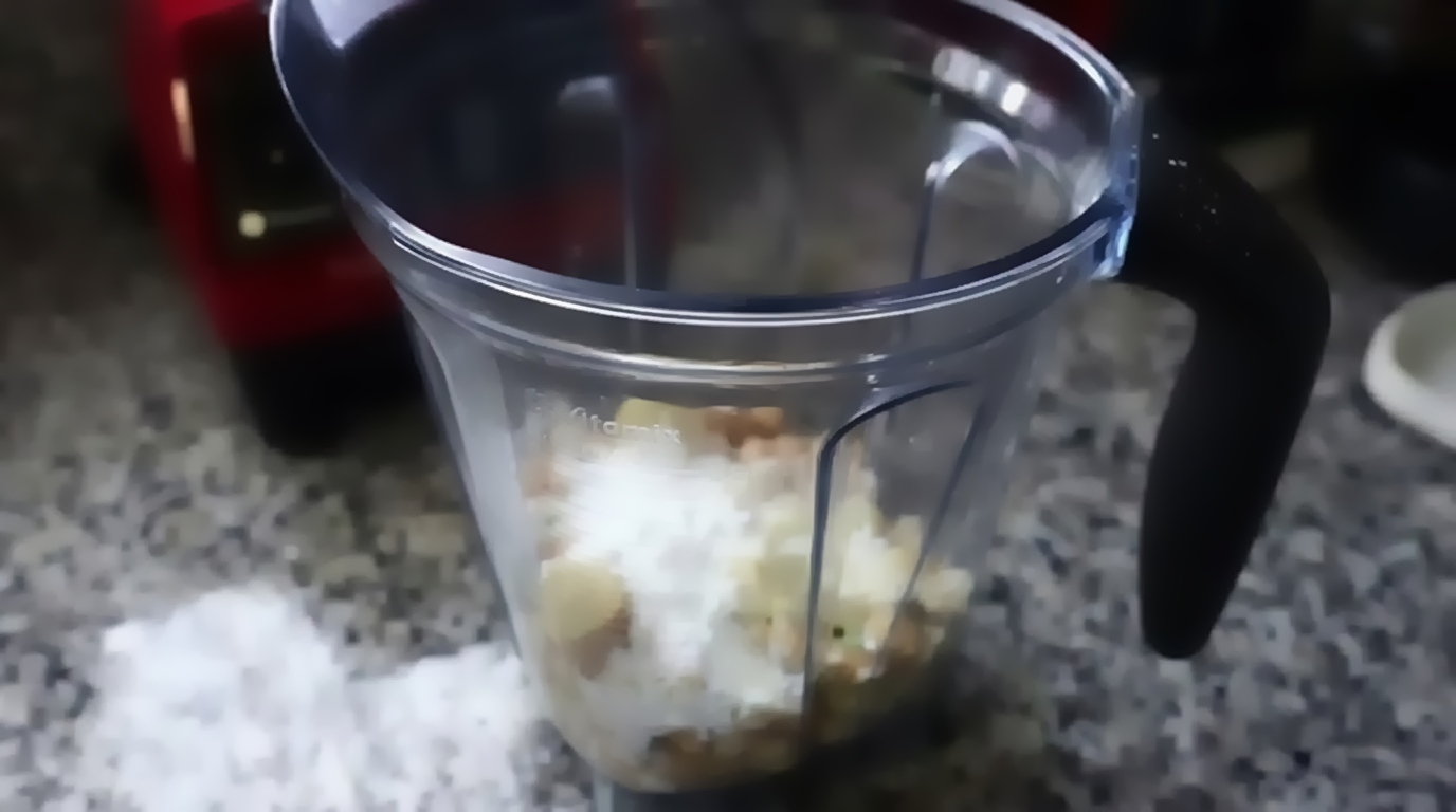 Thick coconut milk, water, and sea salt poured over the chickpeas in the blender