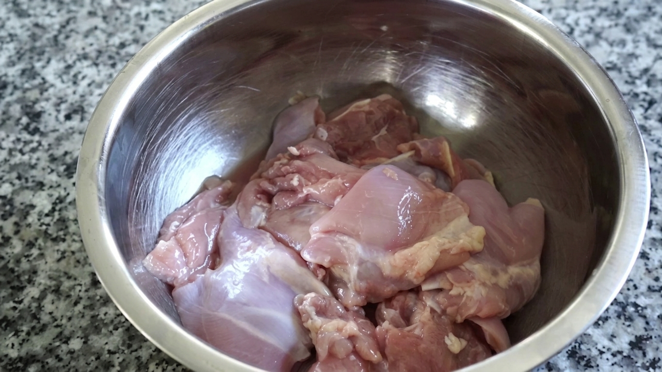 Thick Greek yogurt and aromatic Indian spices blended in a bowl for the second marinade