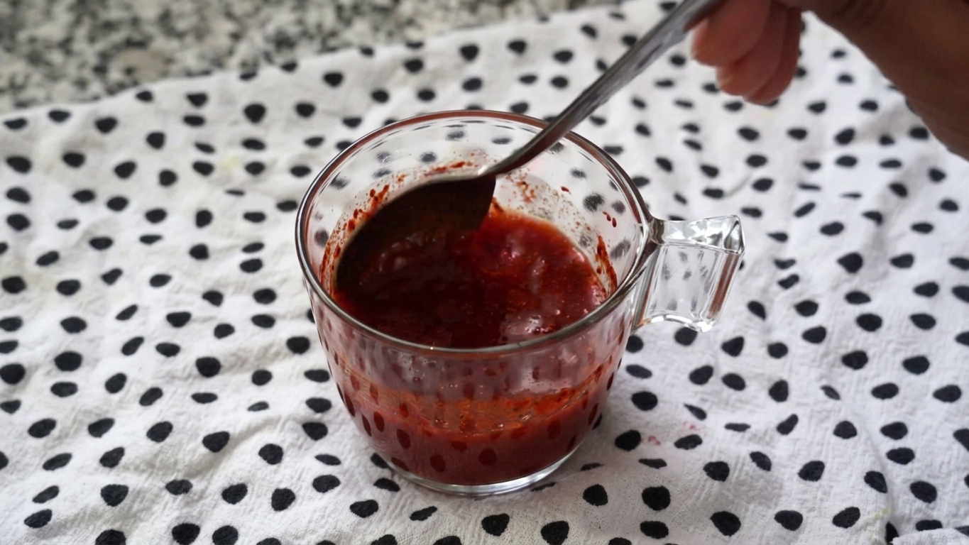 Chili and paprika paste sizzling and bubbling in the melted butter