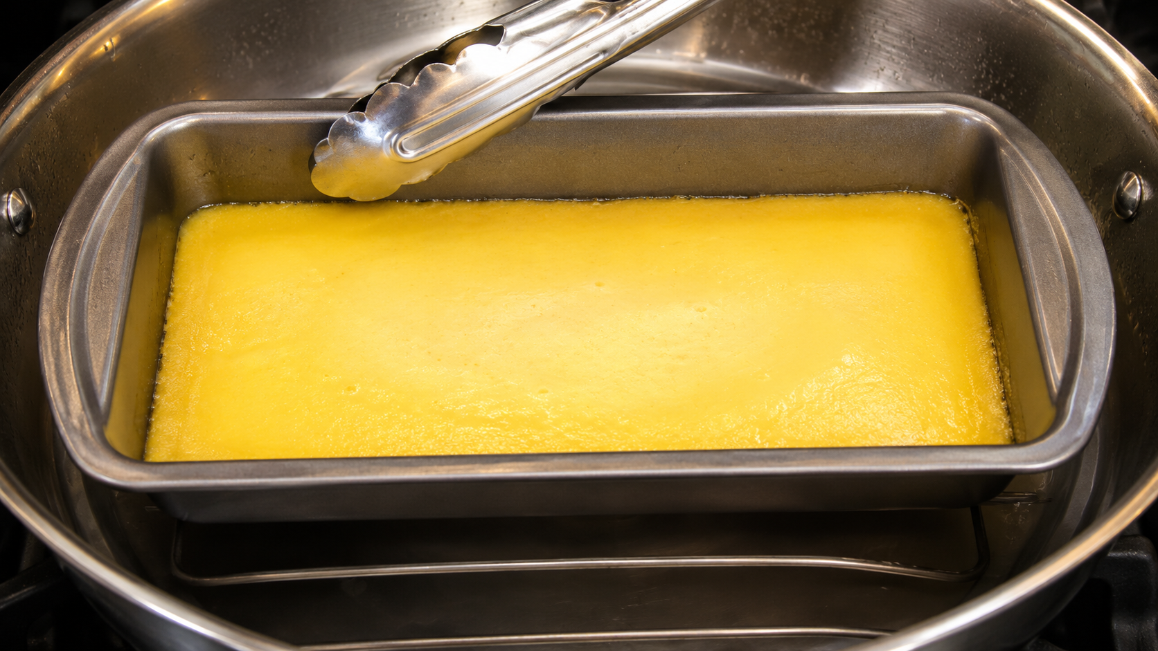 Steamed mango custard with set edges and a slightly jiggly center