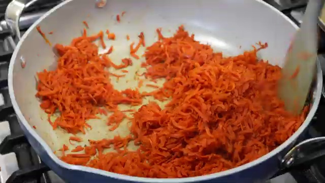 Grated carrots thoroughly mixed and coated with rich sweetened condensed milk