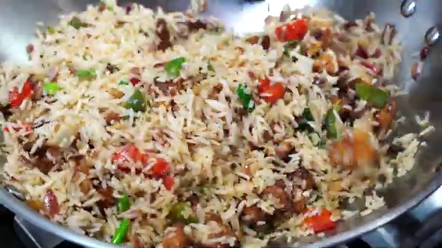 Cauliflower Manchurian fried rice served in a bowl with a refreshing side cucumber salad