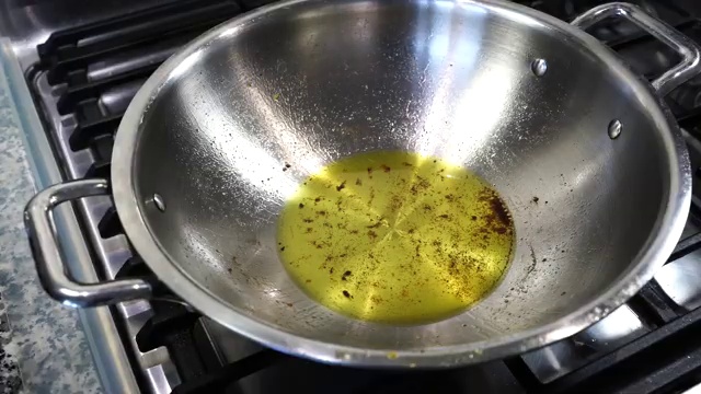 Cauliflower florets turning beautiful golden brown while frying in the pan