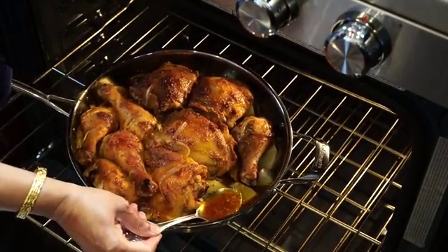 Instant-read meat thermometer inserted into thickest part of baked chicken thigh registering 175°F+