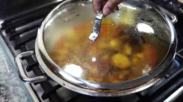 Checking the tenderness of potatoes and cauliflower with a small paring knife