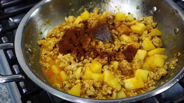 Ground chicken and potato cubes thoroughly coated in the creamy spiced yogurt sauce