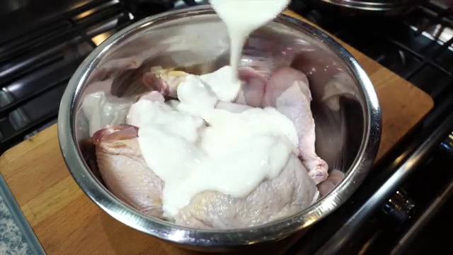 Chicken thighs and drumsticks thoroughly coated in the first buttermilk marinade