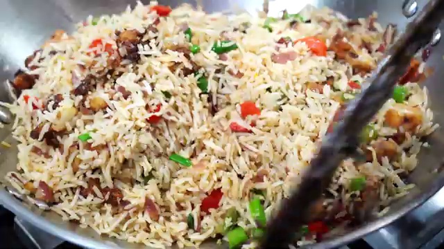 Close-up texture of Cauliflower Manchurian fried rice with crispy florets and fluffy grains