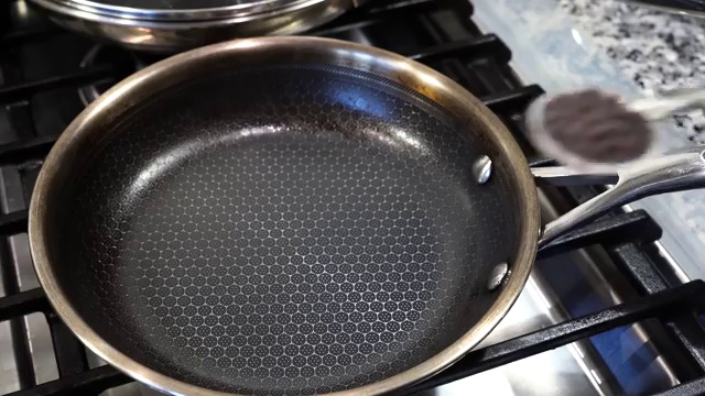Toasted aromatic mustard seeds and panch phoron cooling on a plate before grinding
