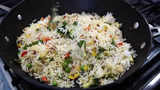 Pan covered with a lid to steam the vegetable masala rice for 2 minutes