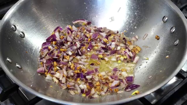 Crispy fried cauliflower Manchurian florets added into the simmering glossy sauce