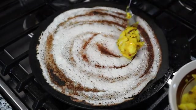 Crispy dosa with potato masala filling spread across the center