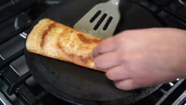 Crispy plain dosa rolled and ready to serve