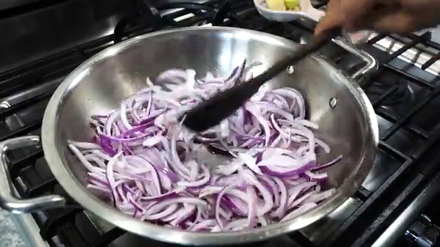 Evenly browned, deeply caramelized sliced onions in the pan for the savory chicken base