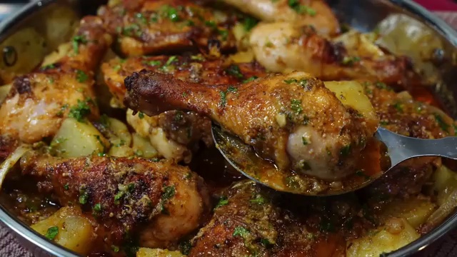 Final succulent oven-baked buttermilk chicken thighs and drumsticks served with golden roasted potatoes