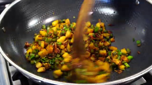 Final plated Aloo Beans Dry Sabji garnished with green onion and served with warm roti