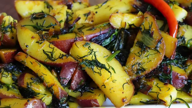 Finished Bengali potato and dill leaves stir-fry served golden and lightly crisp
