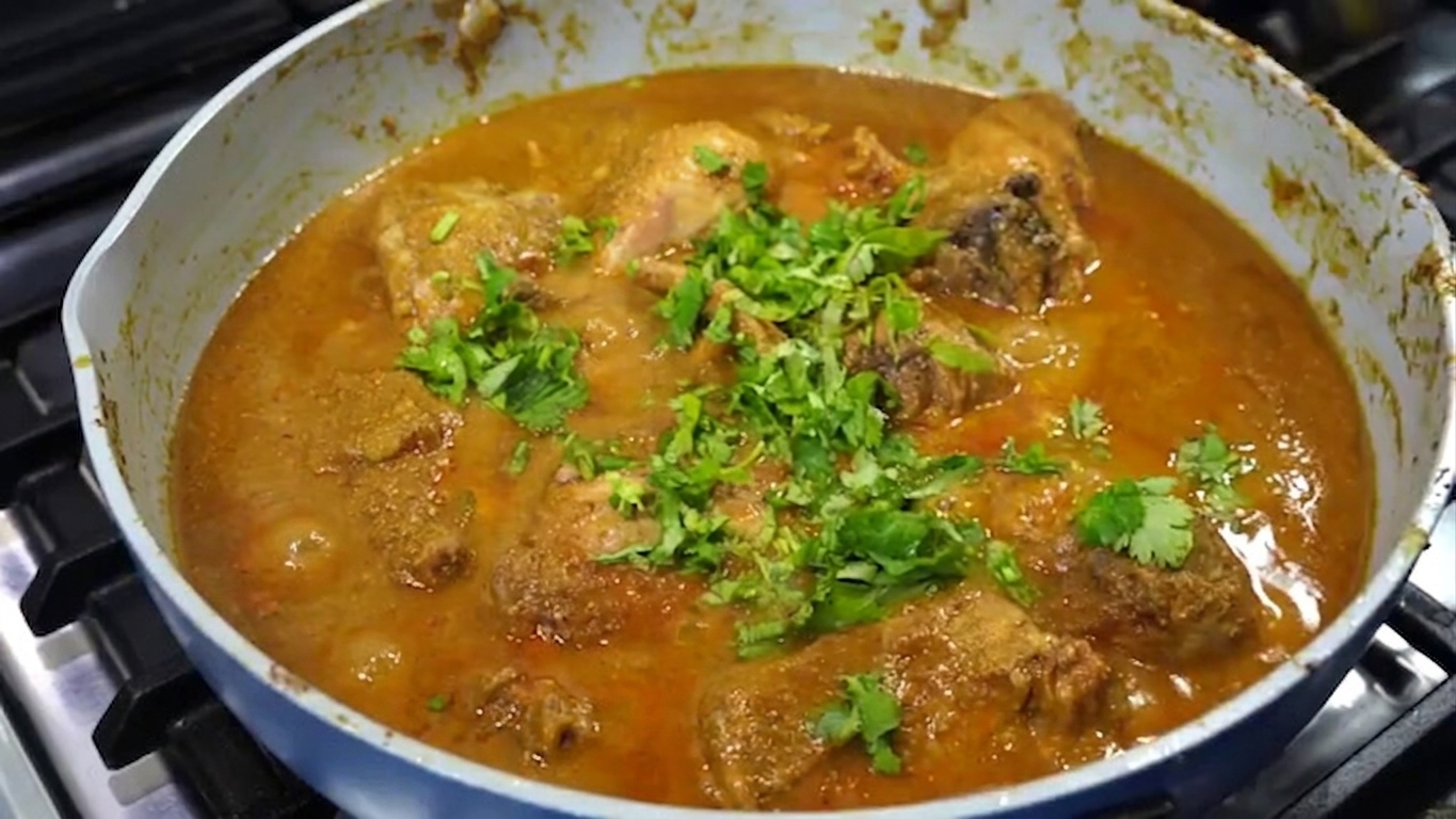 Finished Goan Chicken Xacuti simmering gently with fresh coriander and green chilies