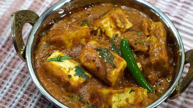 Finished Masala Tofu Curry served in a bowl with a rich glossy gravy and fresh coriander