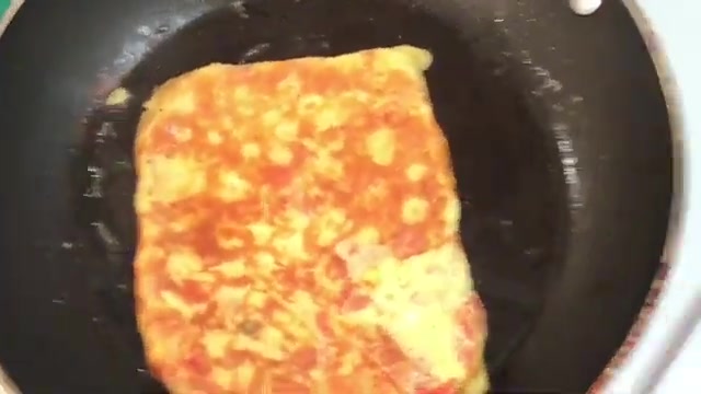 Finished bread omelette with golden toasted bread and cooked omelette attached to one side
