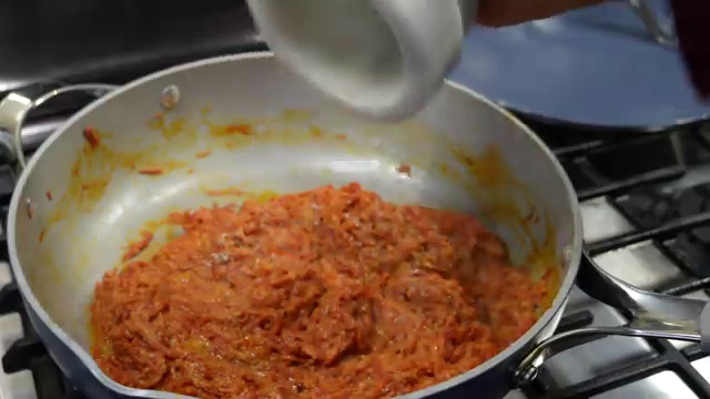 Finished thick, creamy, and velvety carrot halwa in the cooking pan