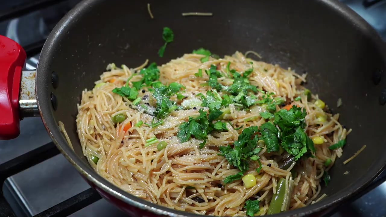 Finished vegetable vermicelli upma garnished with coriander and served hot