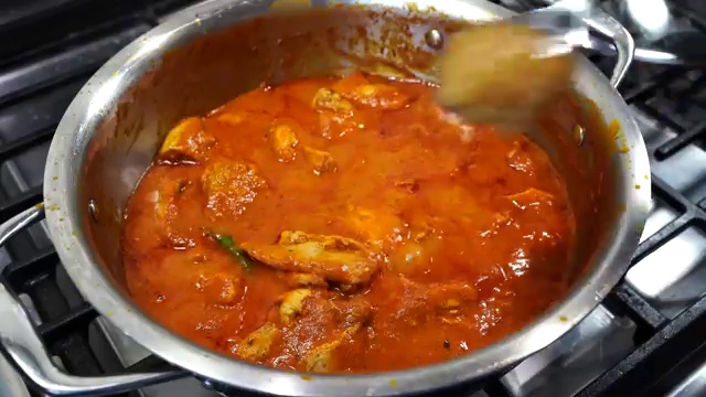 Freshly chopped coriander leaves sprinkled over the hot finished Murgh Makhani