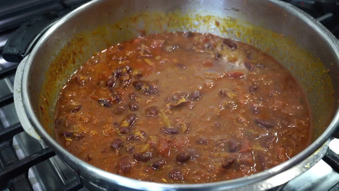 Freshly chopped coriander leaves sprinkled over the simmering rajma curry