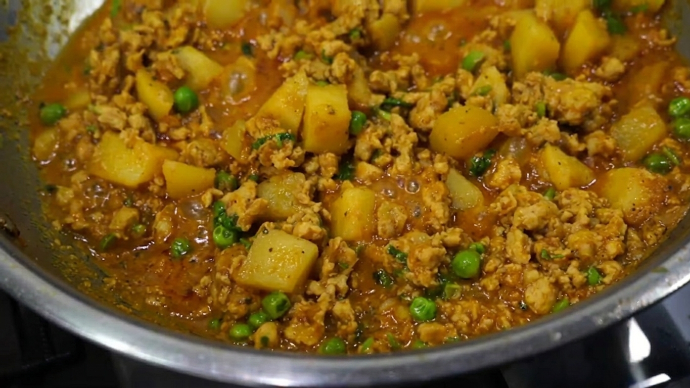 Freshly chopped green coriander leaves sprinkled over the hot finished chicken keema