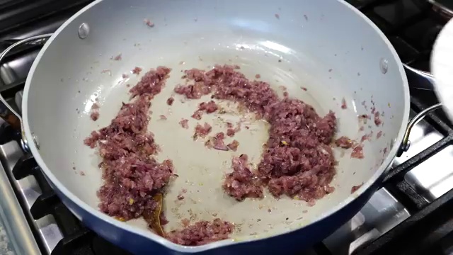 Freshly grated ginger and garlic paste added to softened sautéed onions
