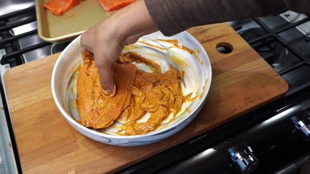 Fully cooked tandoori salmon with charred golden-brown edges in the air fryer