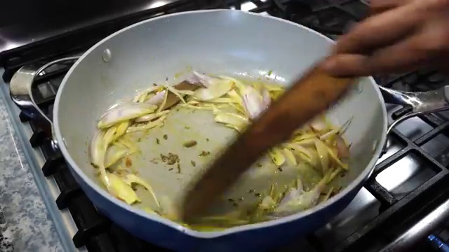 Freshly ground garam masala powder sprinkled into the simmering curry base