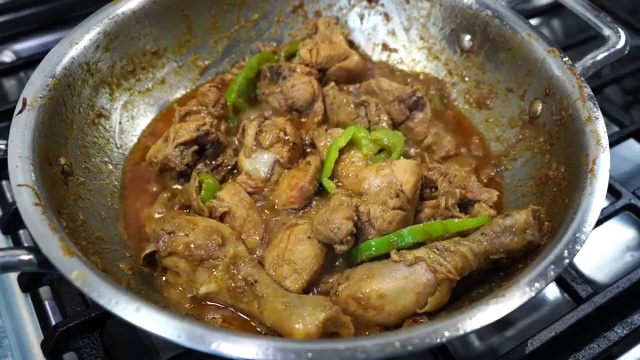 Fresh chopped cilantro leaves and herbs sprinkled over the fragrant pepper chicken