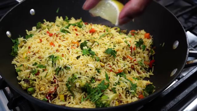 Finished vegetable masala rice gently tossed with herbs and lemon juice