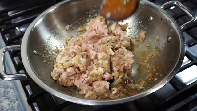 Ginger and garlic paste sizzling and cooking with the onions to release aroma