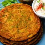 Gluten-Free Chickpea Chilla Recipe - Crispy golden chickpea pancakes served with plain yogurt, cucumber, onion, and bell peppers