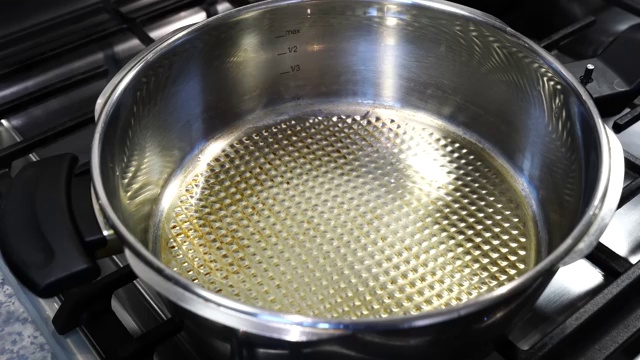 Finely chopped onions cooking over medium heat until fragrant and golden brown